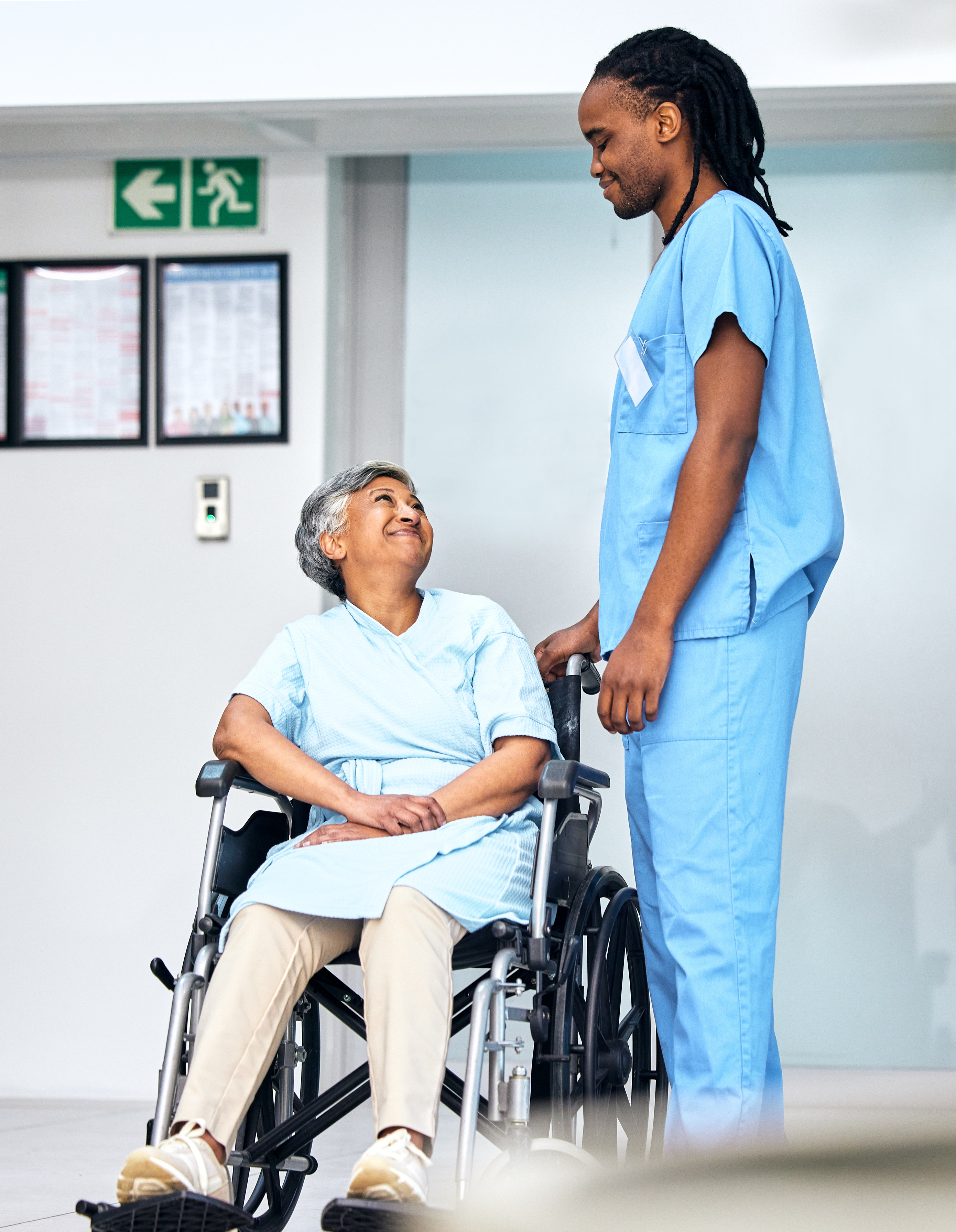 Medical Assistant with Patient in Wheelchair
