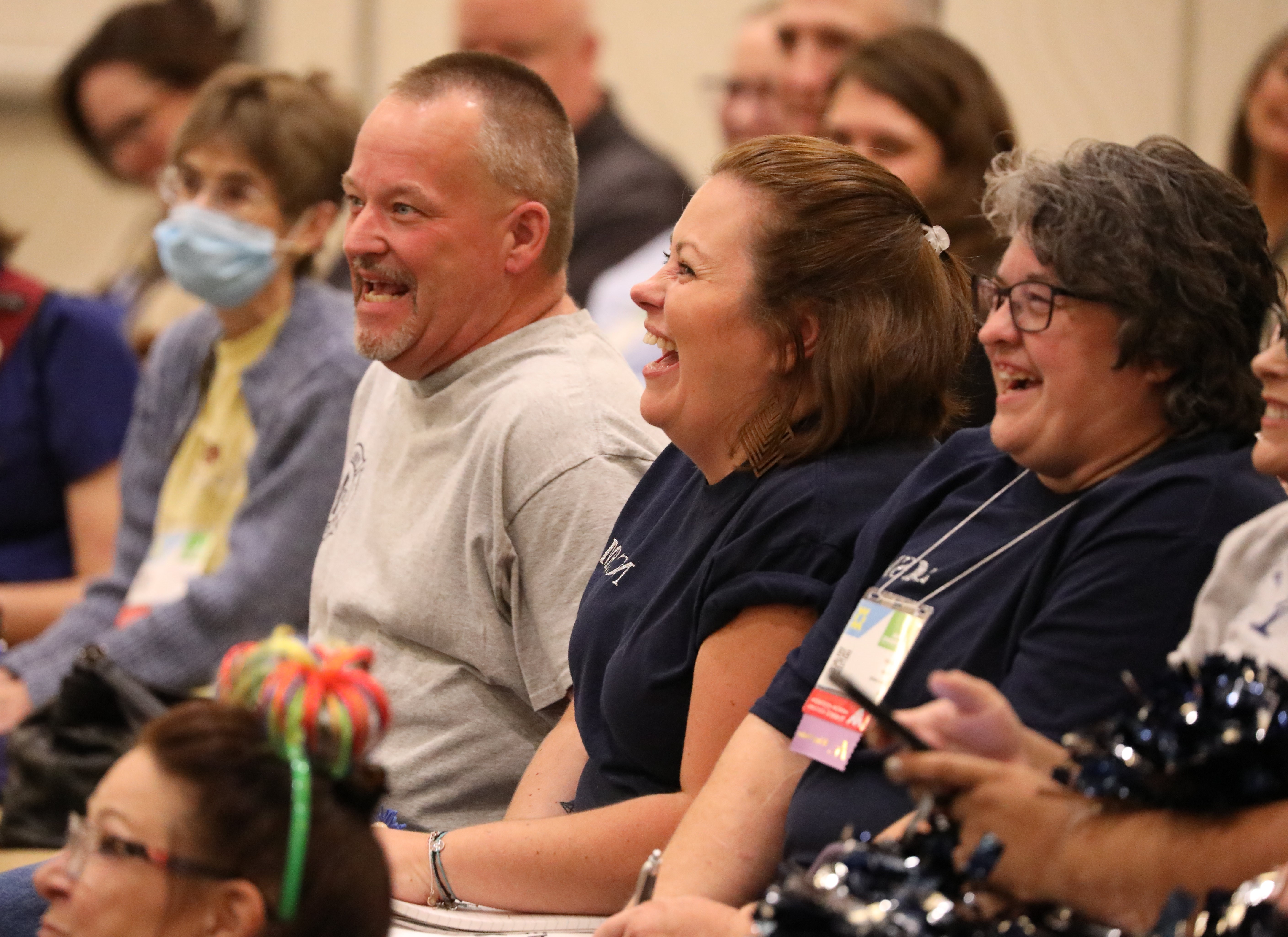2024 AAMA Conference Attendees Seated man and women laughing during the 2024 AAMA Conference